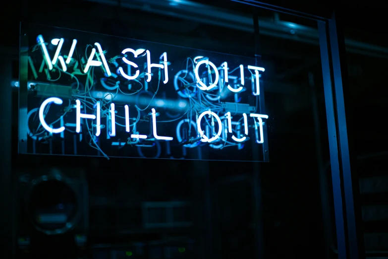 a neon sign that reads wash out chillout