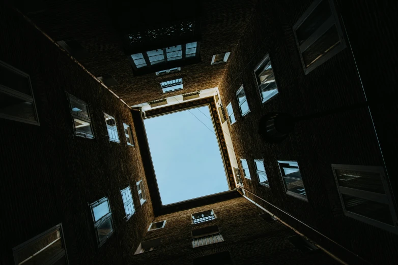 a skylight shining into a room in the middle of a building