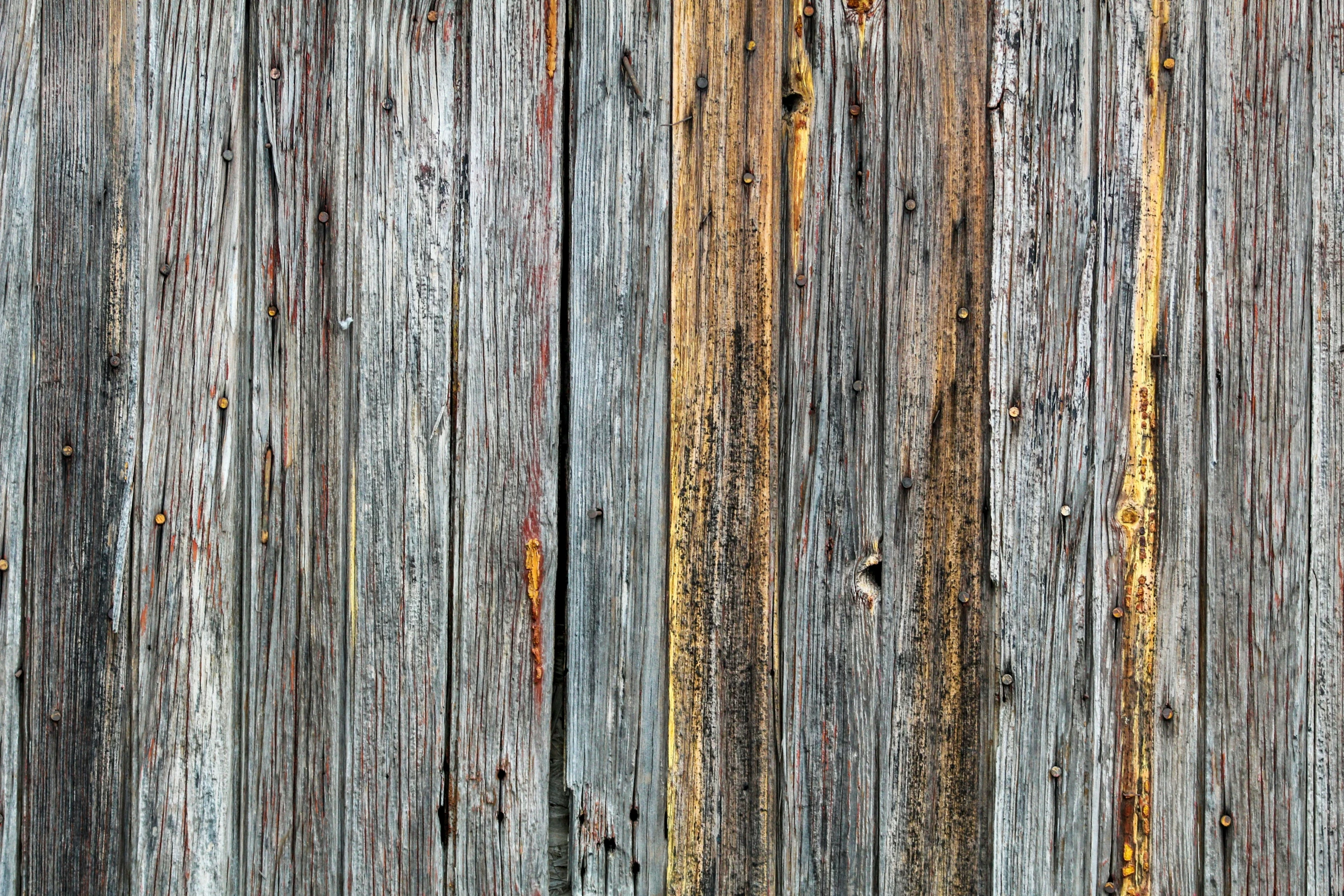 an old wood plank has rust on it