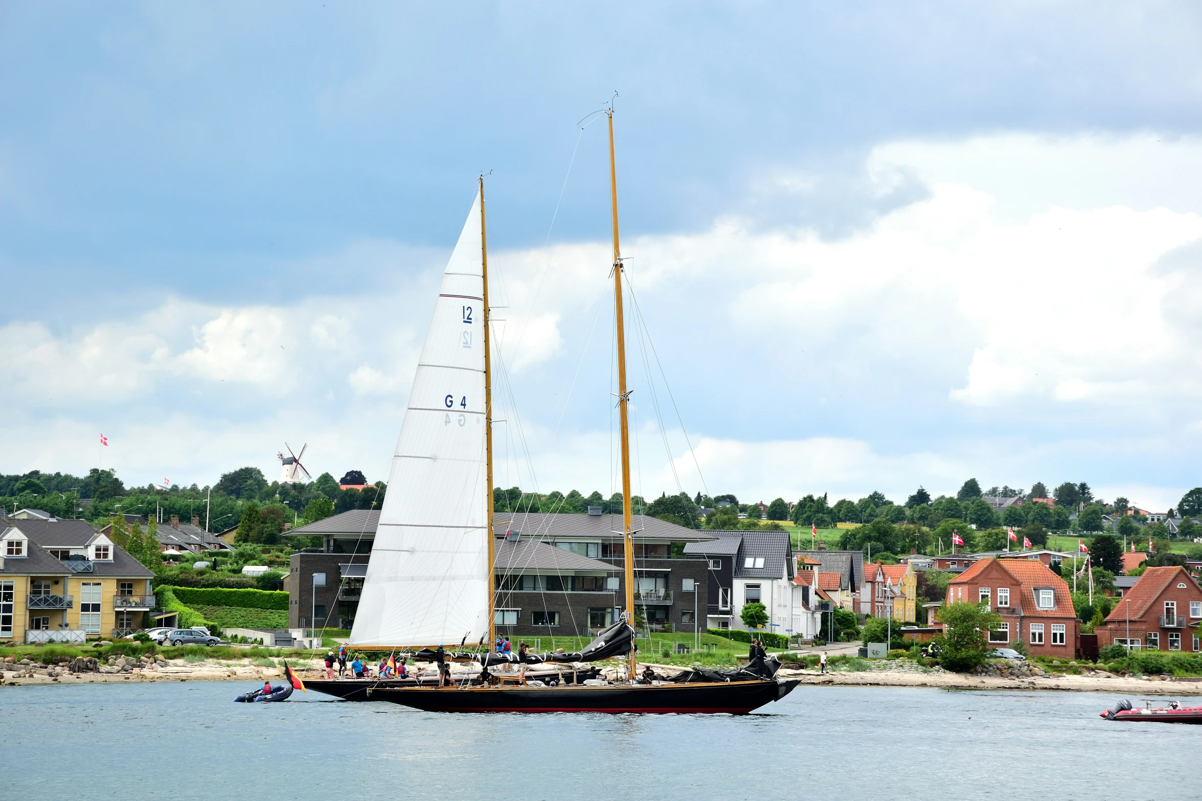 an old sail boat sailing in the water