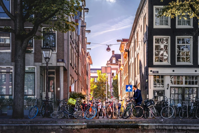 bicycles are parked along the side of a city street