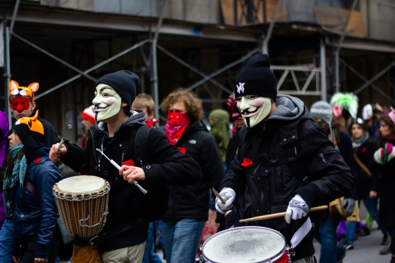 several people walking together with clown costumes on