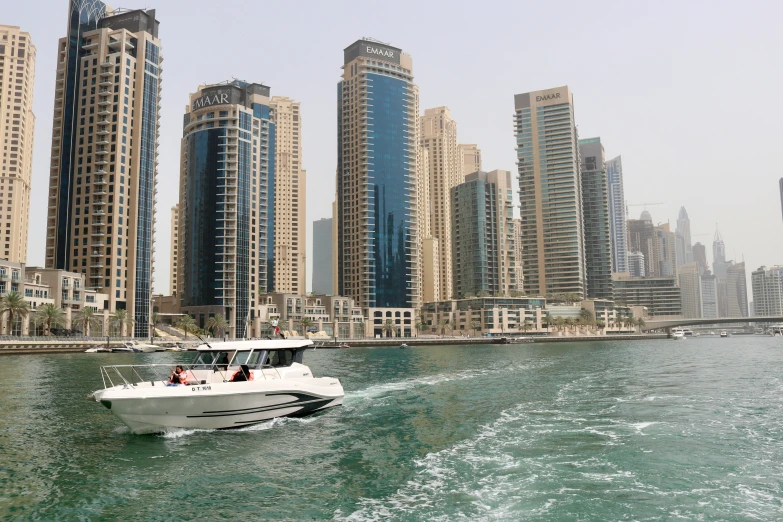 a boat that is in the water near buildings