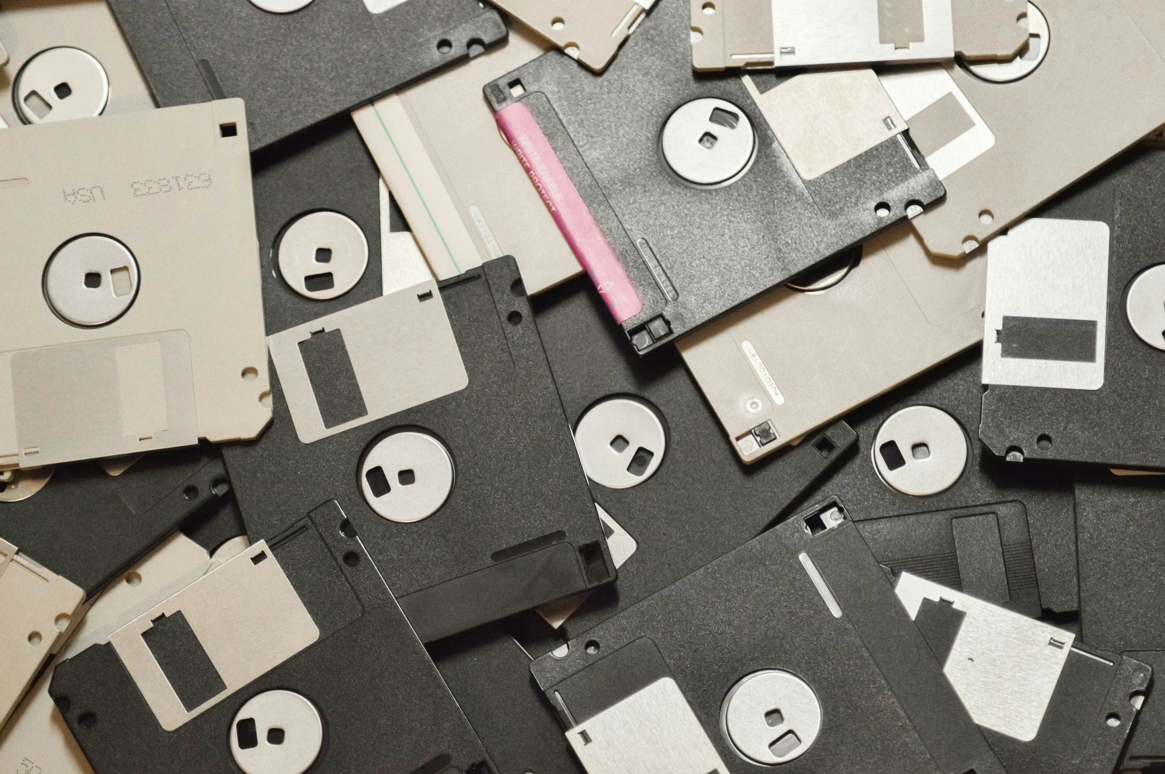 an assortment of old floppy disks and floppys