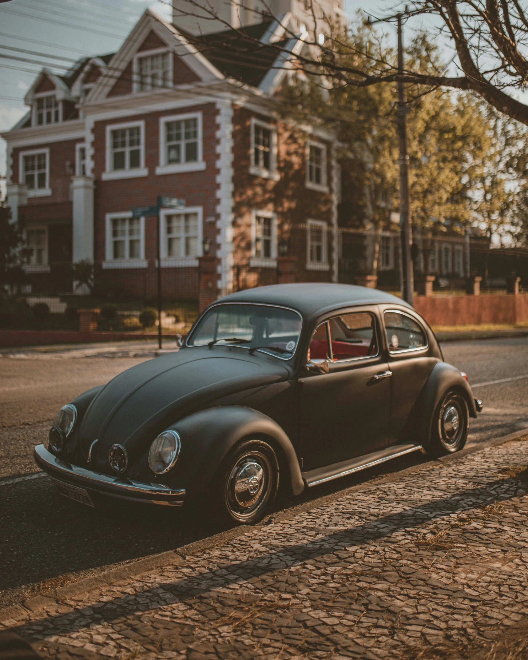 the old vw bug is on the side of the road