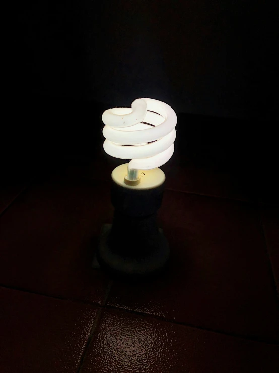 this light bulb has turned off on a dark surface