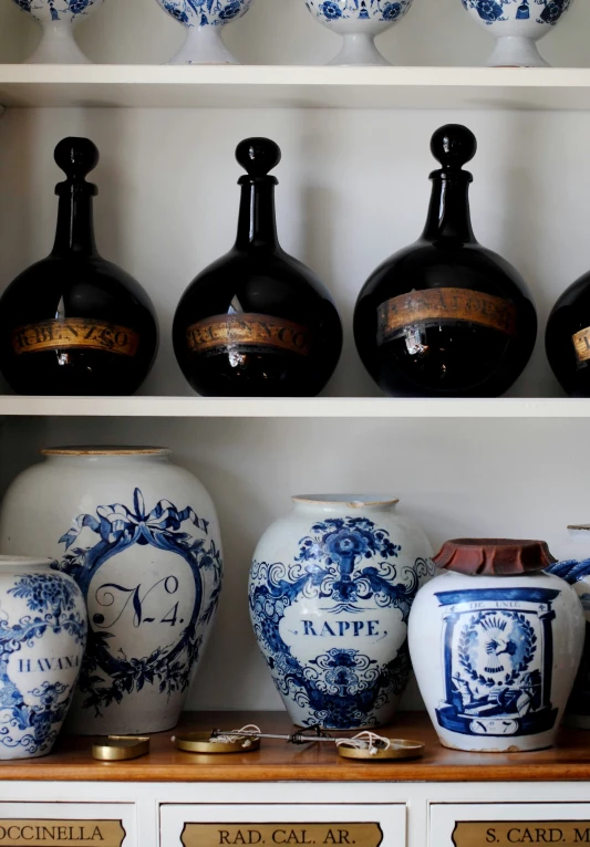 the shelves in a room are full of various vases