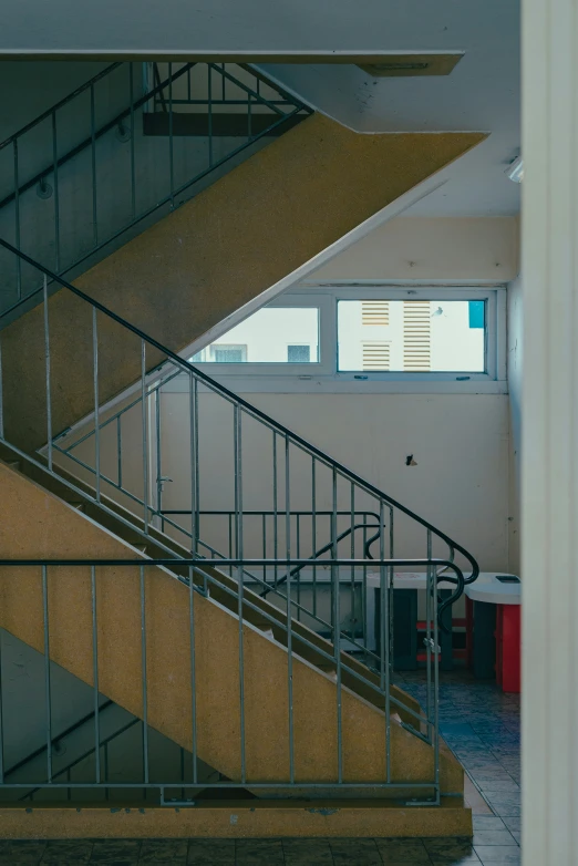 an empty and empty hallway with a staircase