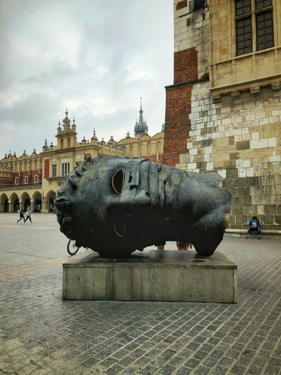 the sculpture is on display in front of a building