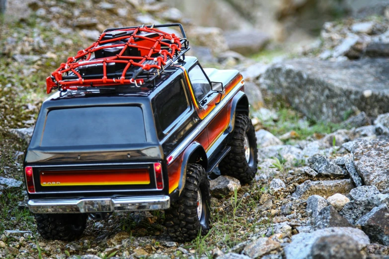 an suv is parked on the rocky terrain