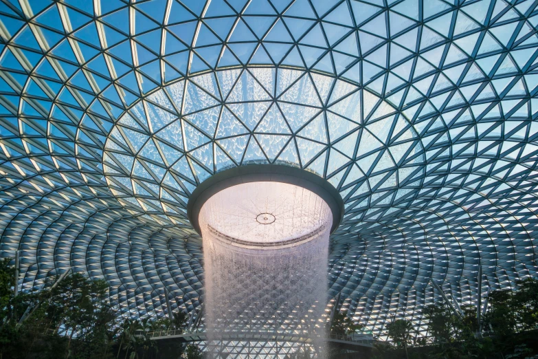 the inside of a building with large glass walls and ceilings