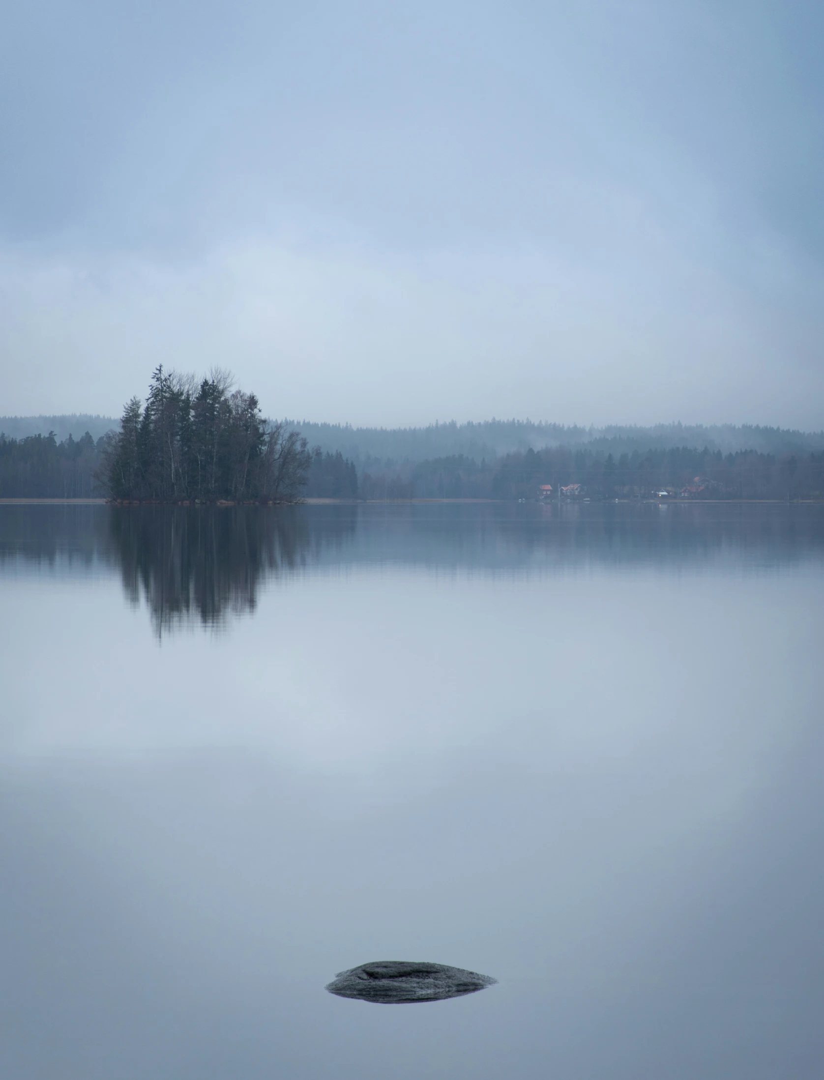 a cloudy day at the lake in the country