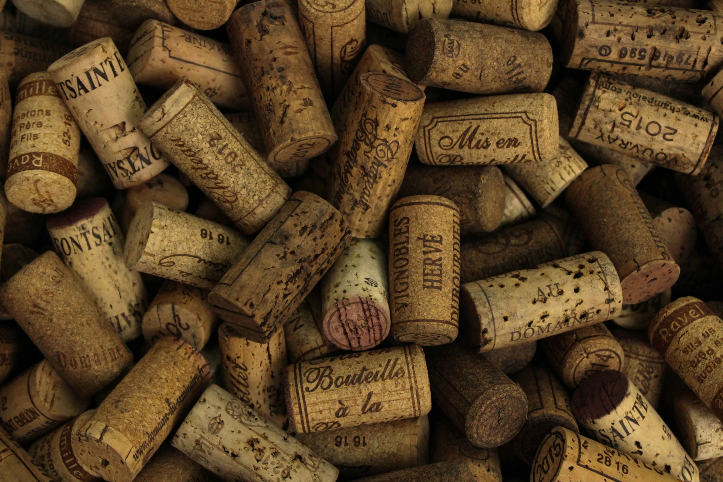 a pile of wine corks that are laying on the ground