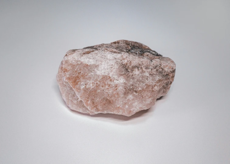 a large rock sits in an open room