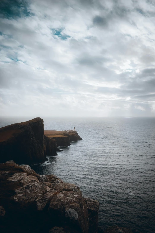 the boat is sitting on the end of the cliff