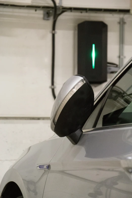 an electronic parking light sits in front of a car