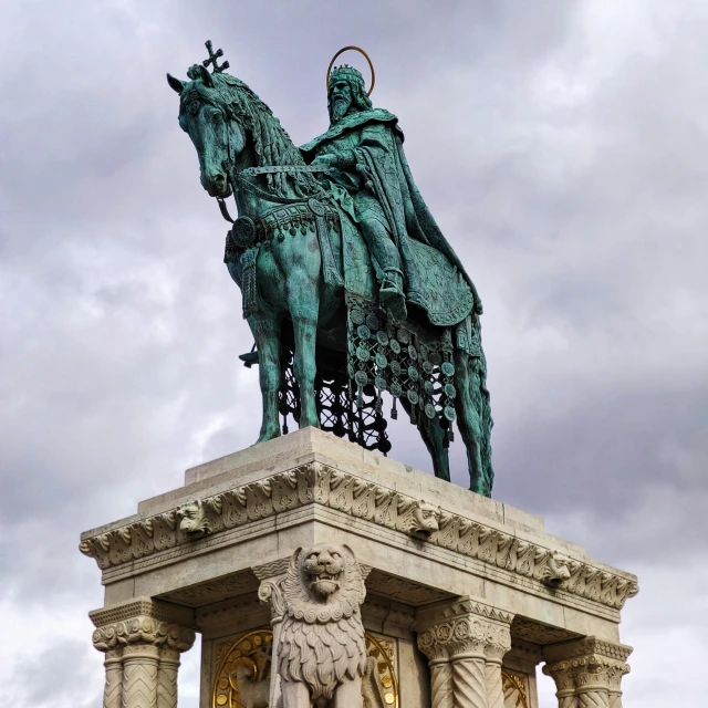 a statue of a knight riding a horse and a lion