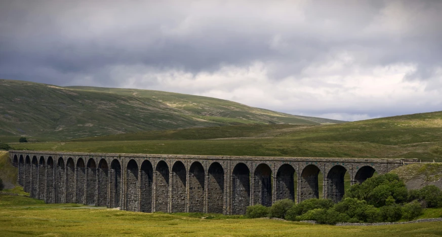 a very large train that is on a bridge