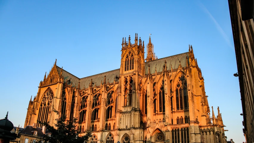 the large, orange cathedral looks majestic at sunset