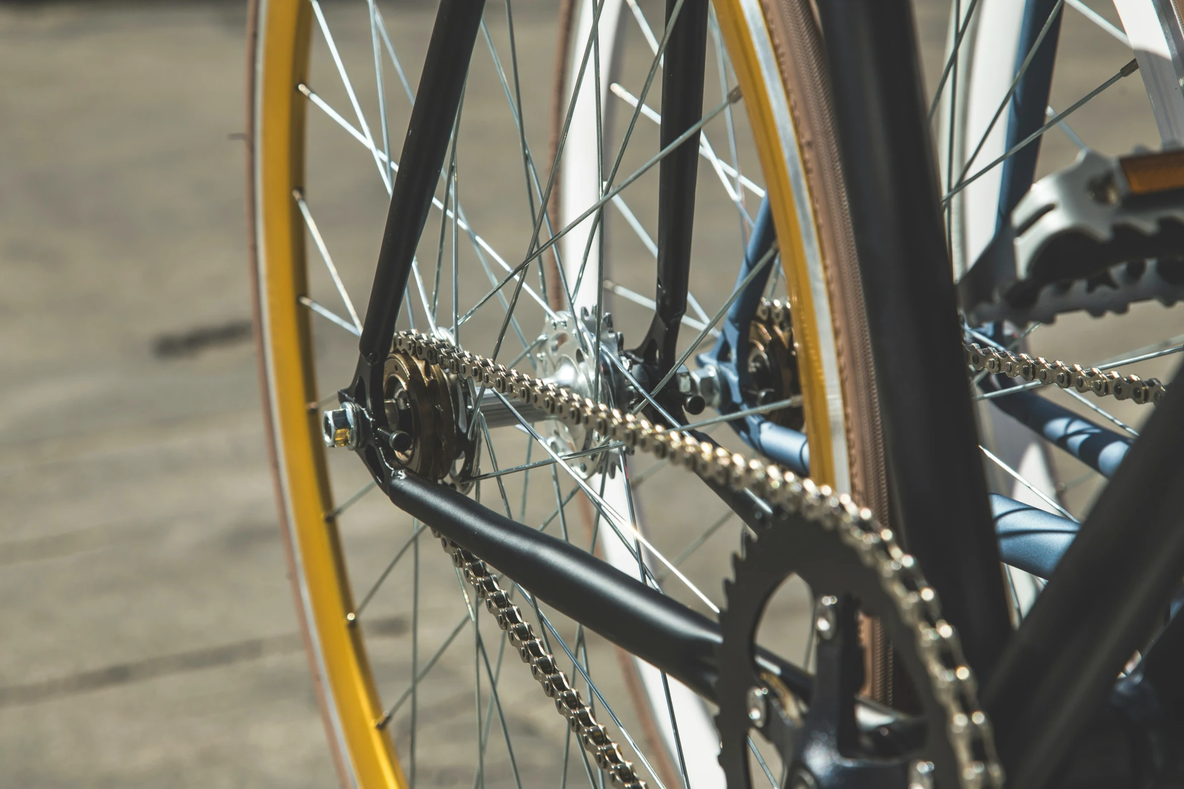 the front wheel of a bicycle with chain and gears