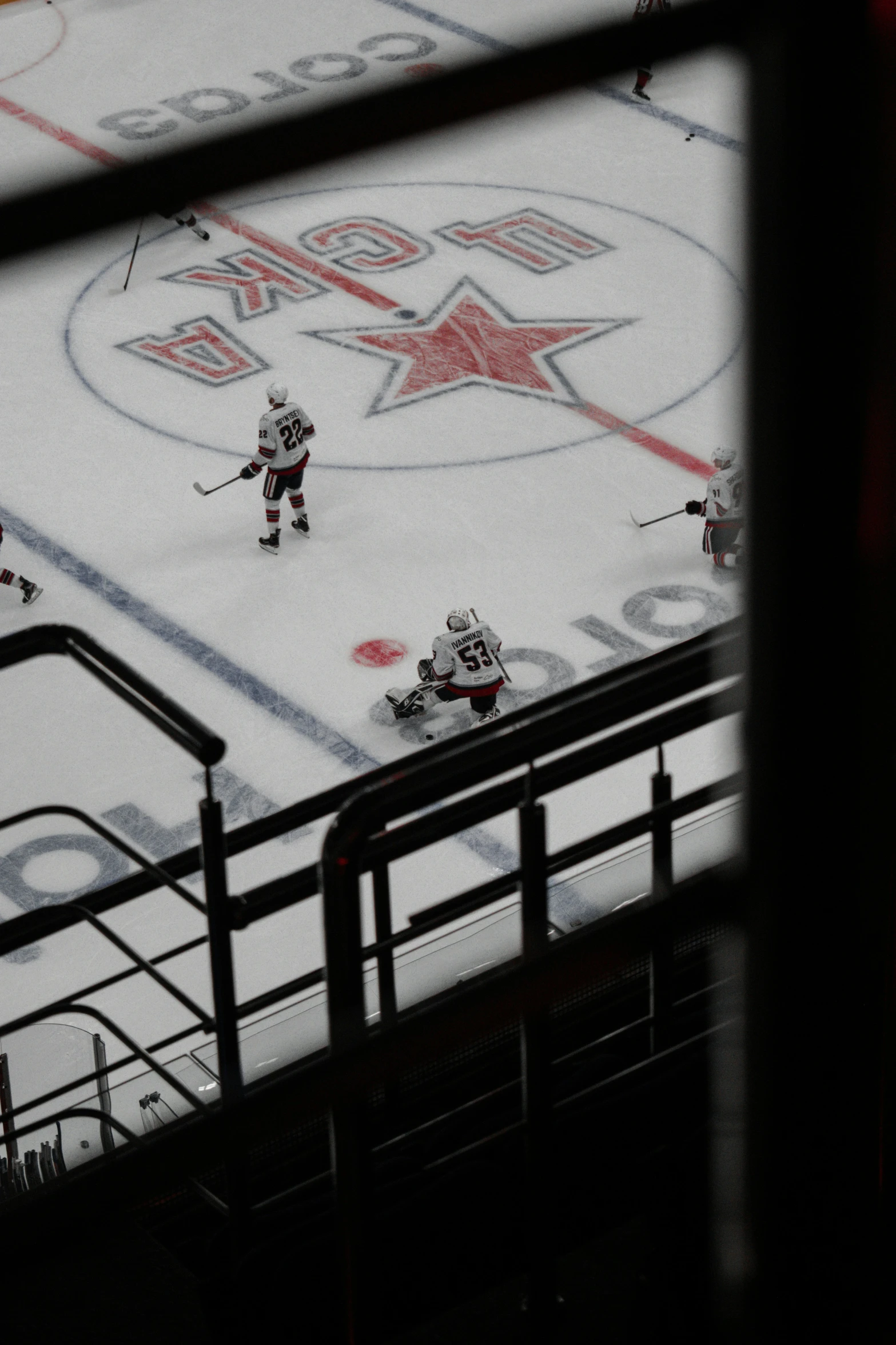 the hockey players are on the ice playing