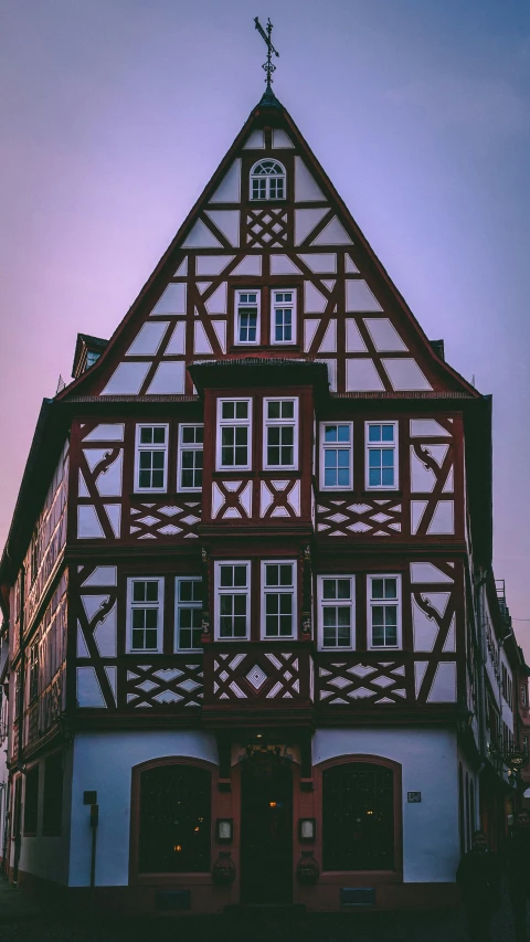 the top of a large building with multiple balconies and a clock on it