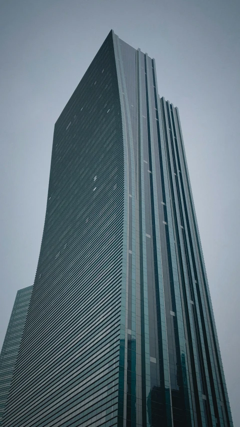 a building on a cloudy day that looks like a very tall building