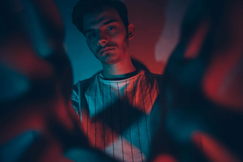 a man with a red and blue light in his shirt