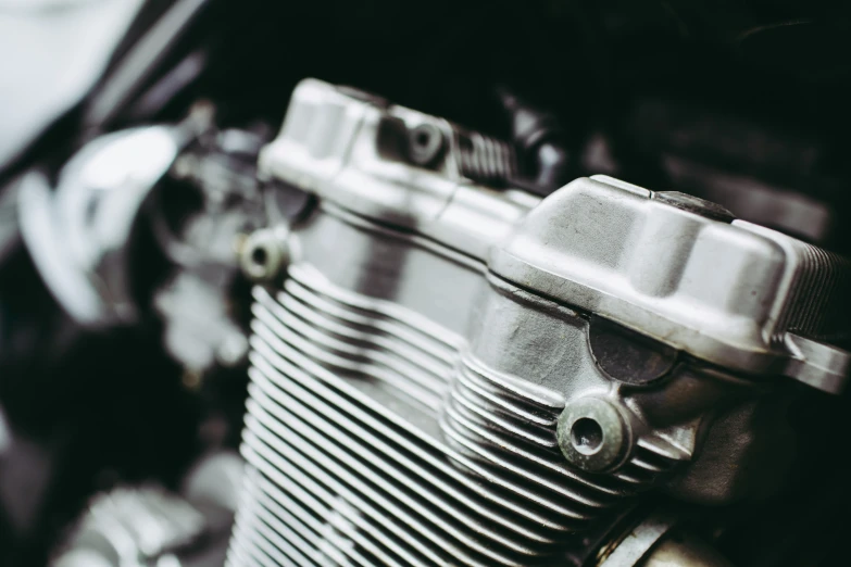 closeup image of motorbike engine on black and white background