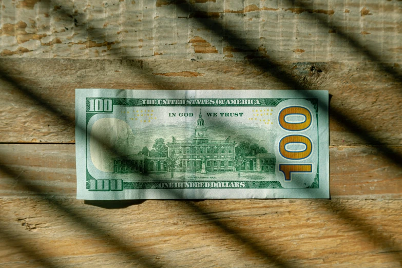 a paper money with a small hole between two bars