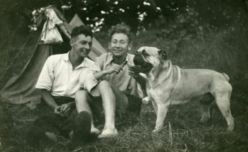 an old po with two men, and a dog