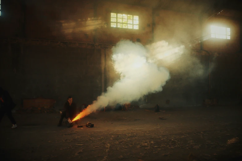 a person standing in an indoor area by a fire