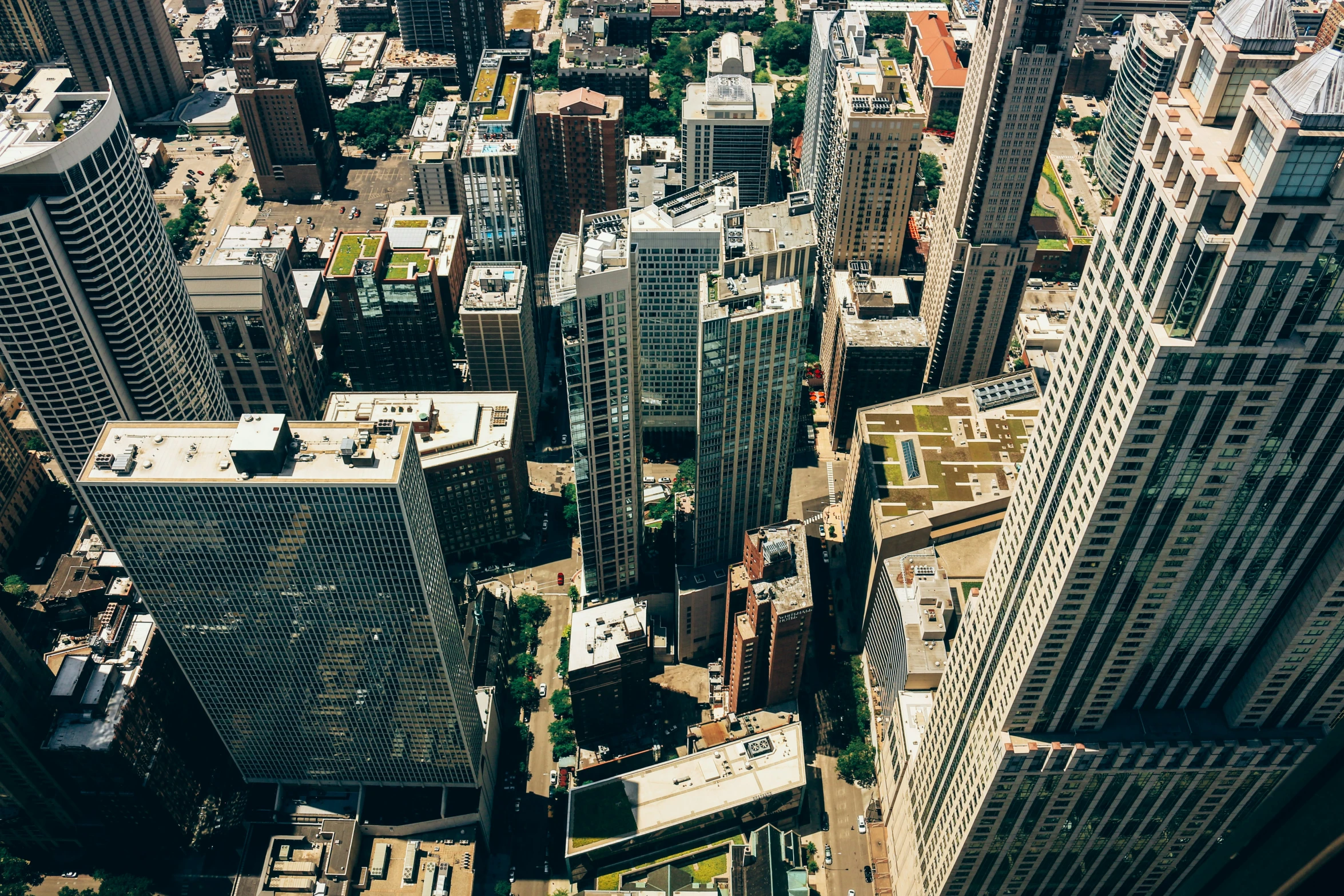 an aerial view of the top of tall buildings