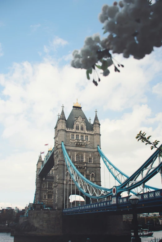 the sky above the bridge is full of clouds