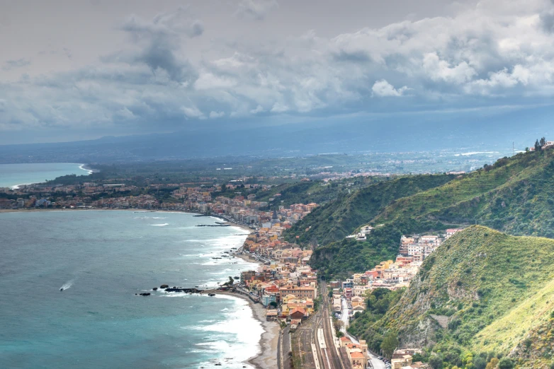 a scenic view of a city, on the edge of a cliff