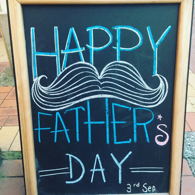 a black sign with a father's day quote written on it