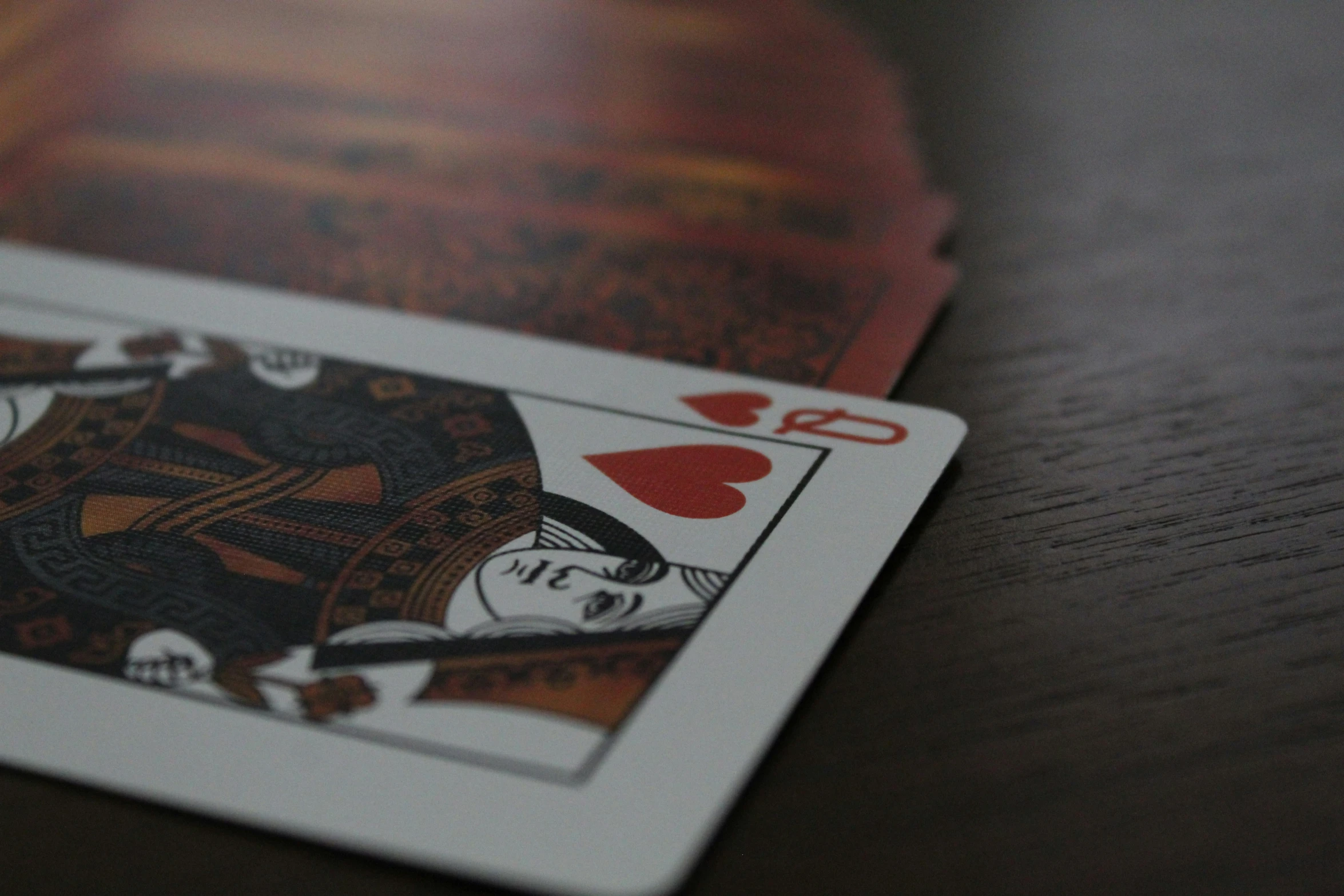 a pair of playing cards sitting on top of a table