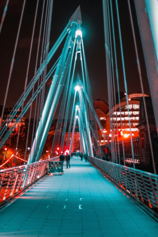 a blurry image of a bridge with some lights on it