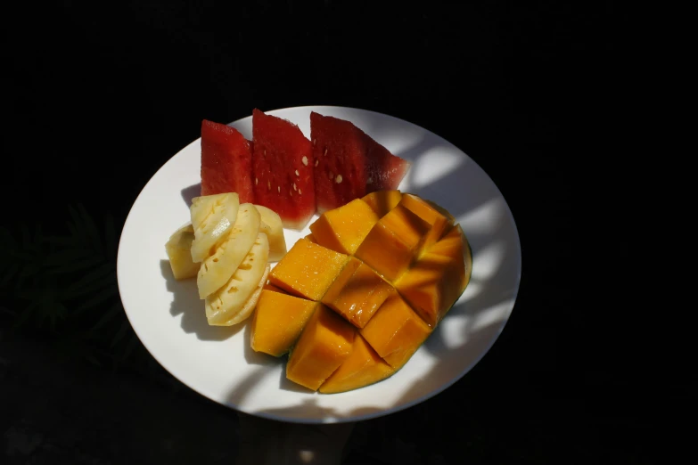 a plate with cut up and chopped fruit