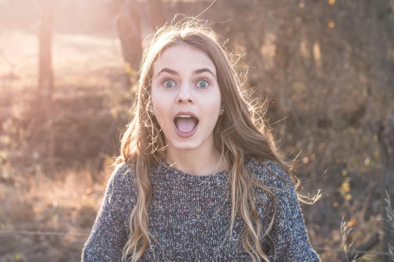 a woman making an expression with her eyes open