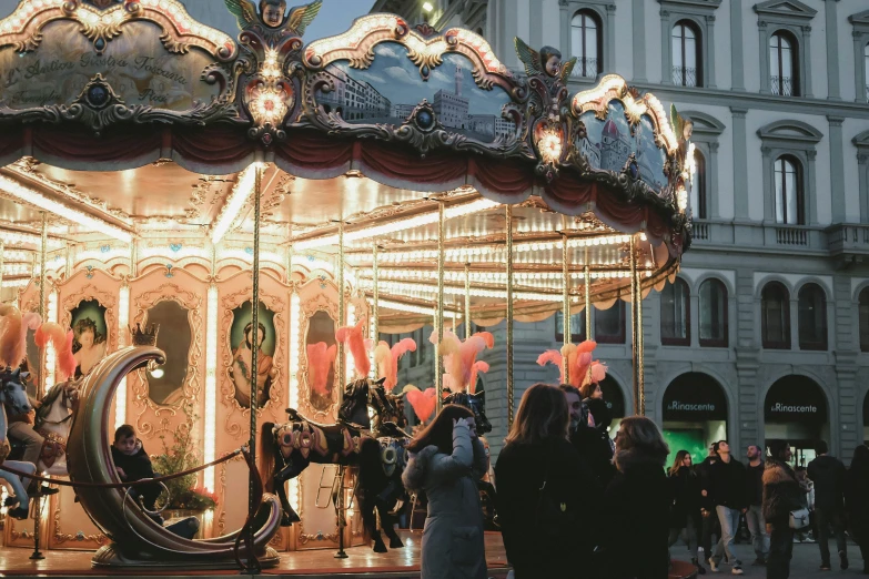 the carousel is decorated with colorful lights and fairy decorations