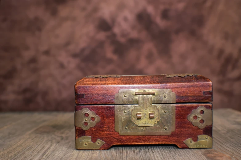 an old looking wooden box on a table