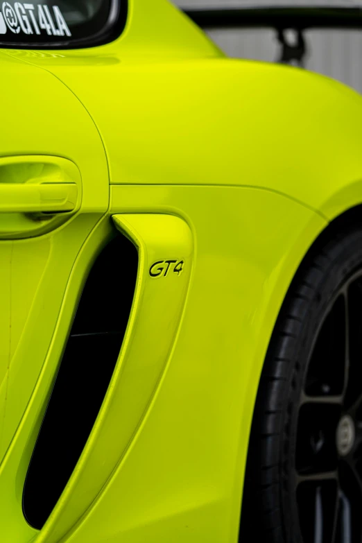 the back end of an all new supercar with gloss yellow paint