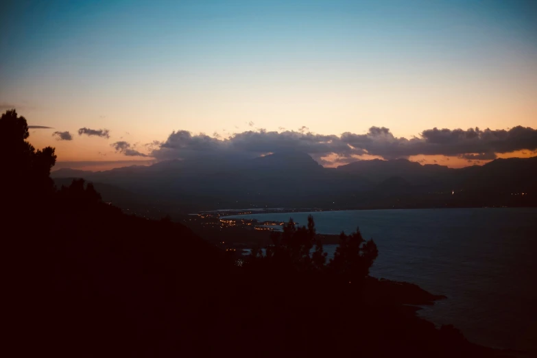 a sunset view looking towards the ocean and mountain