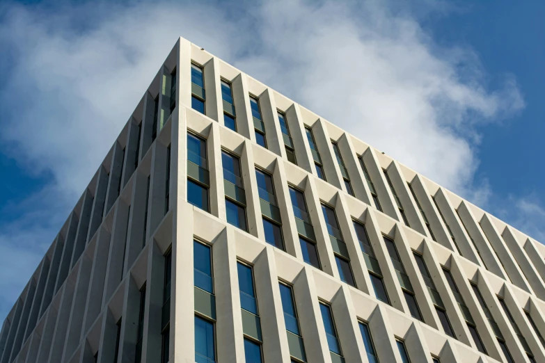 an architecturally tall building with windows in the sky