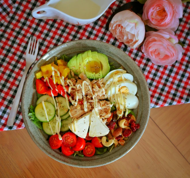 bowl filled with food and fork sitting on table