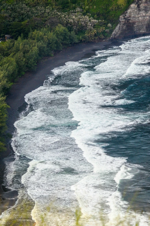 the surf is hitting the beach on the shore