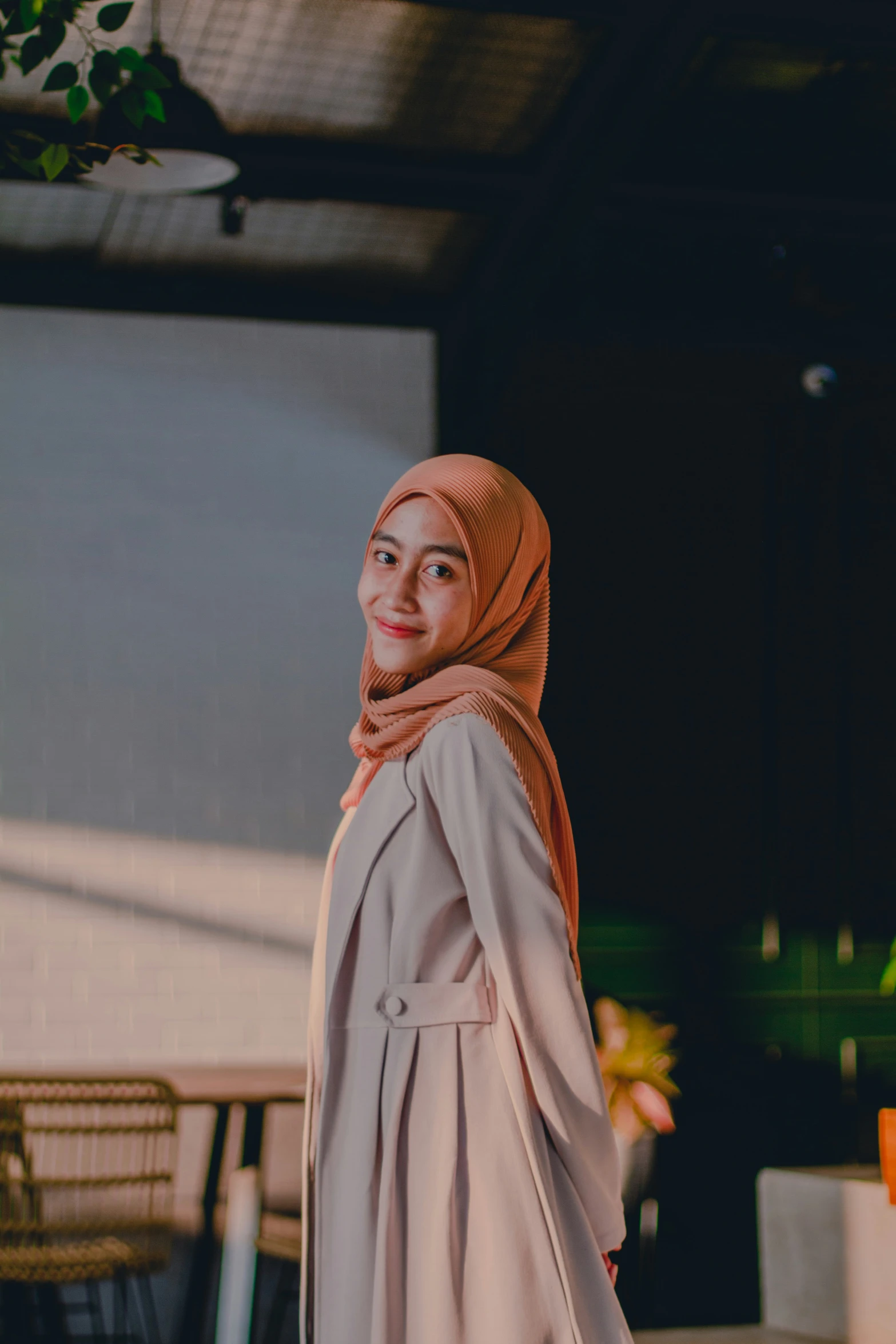 a woman stands before a stage at the festival