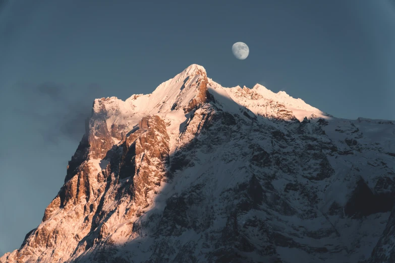 a view of a large mountain with snow and lights on