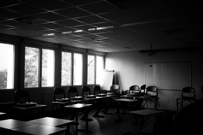 this black and white po shows a classroom with desks